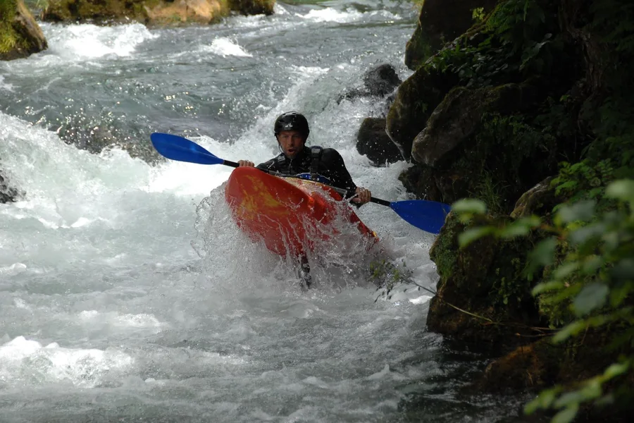 Kayaking through rapids on the Cetina river