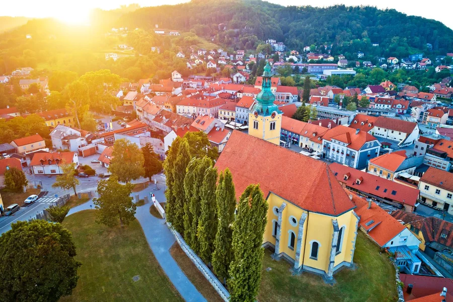 Aerial view over Samobor's old town church and rooftops at golden hour