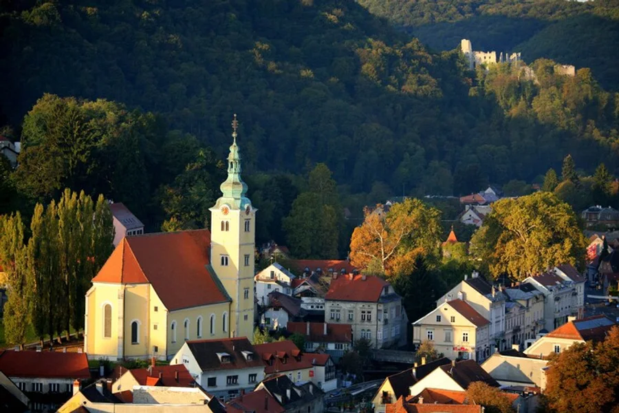 Samobor old town and its church below the wooded hills