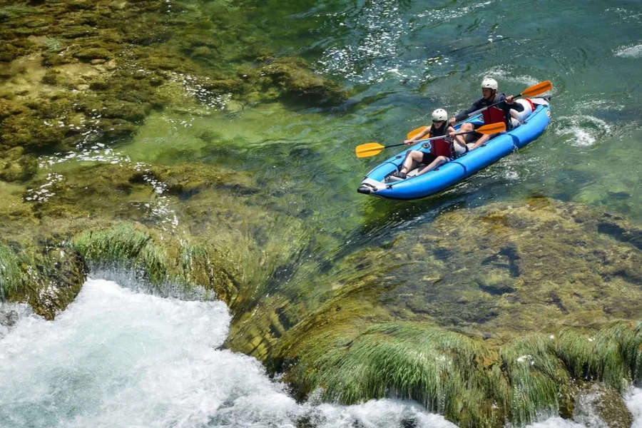 Kayaking over the clear shallows of the Zrmanja river