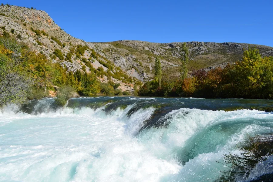 Rapids tumbling over travertine steps on the Zrmanja river