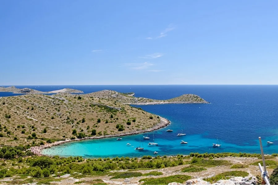 Sheltered bay with boats at anchor in the Kornati islands
