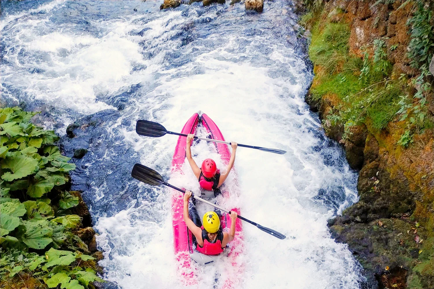 Kayak going over a travertine cascade drop on the Mrežnica River