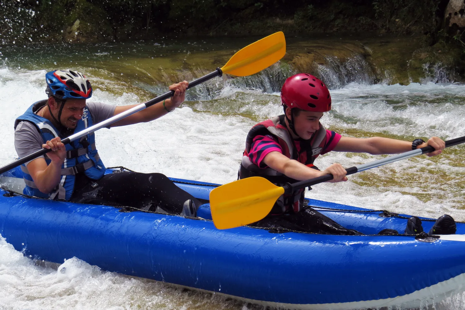 Kayakers paddling through a gorge on the Mrežnica River