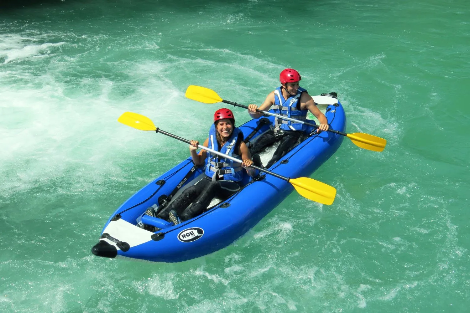 Kayakers paddling through rapids on the Mrežnica River, Croatia