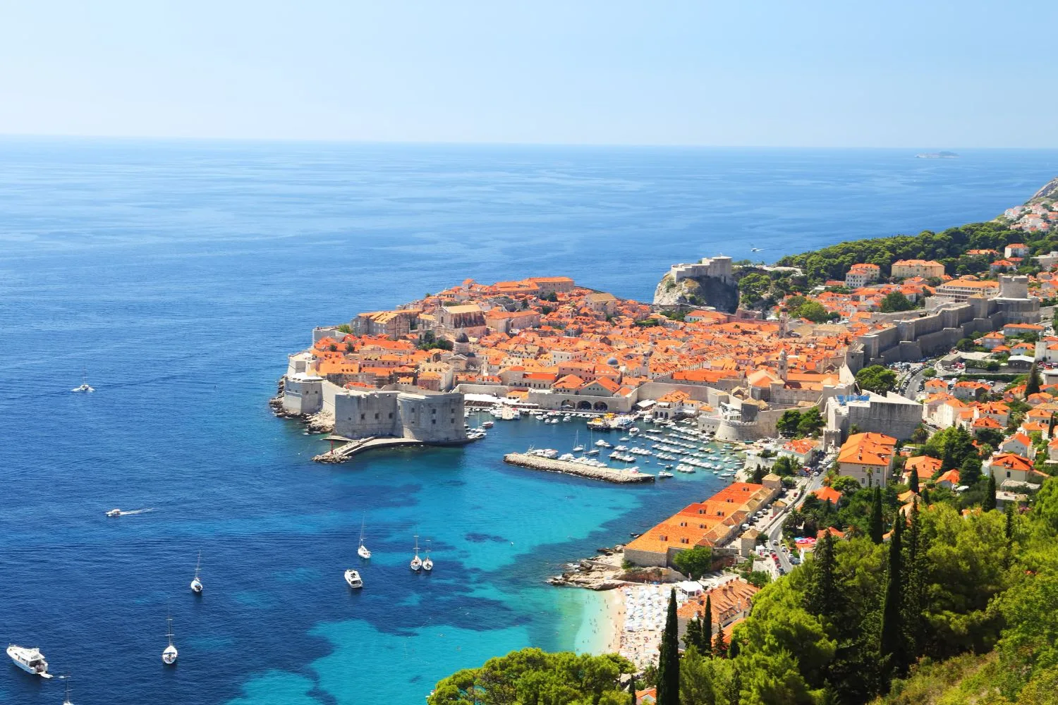 Dubrovnik old town harbour seen through a stone window, Zadar to Dubrovnik private transfer